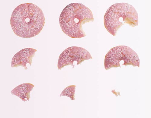sequence of bites taken from pink donut - food stock pictures, royalty-free photos & images