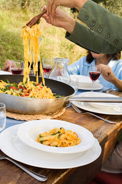 serving tagliatelle pasta - food fotografías e imágenes de stock