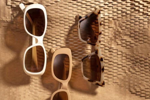 set of fashion collection sunglasses - horn rim sunglasses on abstract geometric background made of brown wrapping paper with sunlight. - fashion stock pictures, royalty-free photos & images