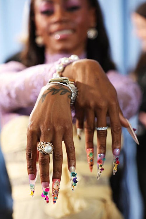 Sha'Carri Richardson, nail and jewelry detail, attends the 2025 Met Gala Celebrating "Superfine: Tailoring Black Style" at Metropolitan Museum of Art...