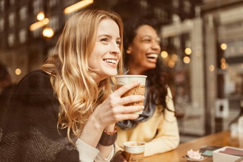 sharing a laugh with my friend - coffee stockfoto's en -beelden