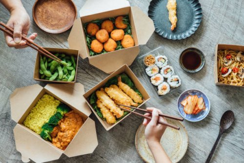 sharing assorted takeaway meal at home - junk food stock pictures, royalty-free photos & images
