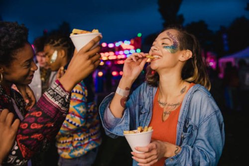 sharing chips at a festival - food stock pictures, royalty-free photos & images