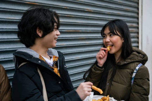 sharing fish and chips - junk food stock pictures, royalty-free photos & images