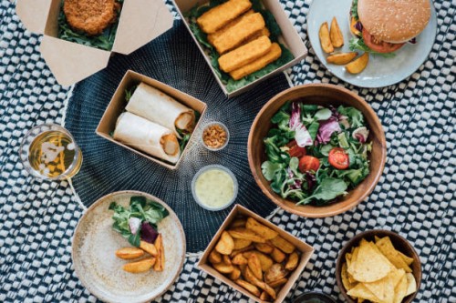 sharing takeaway food at home - junk food stock pictures, royalty-free photos & images