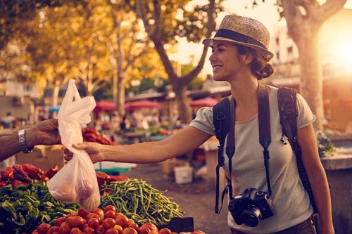 she couldn't walk by without buying some local goodies - food stock pictures, royalty-free photos & images