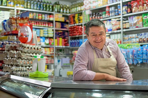 shopkeeper at a local food shop - food stock pictures, royalty-free photos & images
