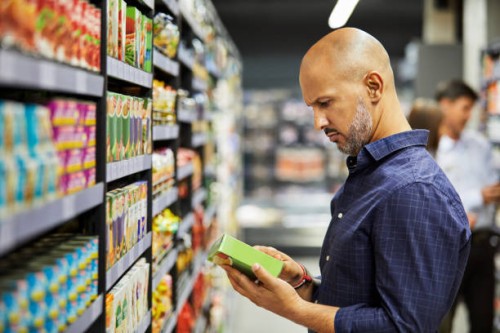 shot of a man shopping for groceries in a supermarket - food stock pictures, royalty-free photos & images