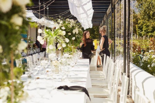 shot of two masked young women decorating a wedding venue together - garden decoration stock pictures, royalty-free photos & images
