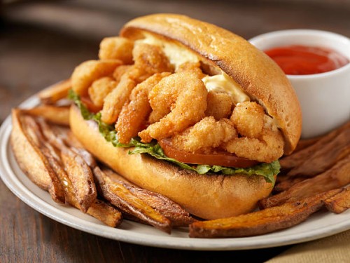 shrimp po boy sandwich with french fries - food stock pictures, royalty-free photos & images