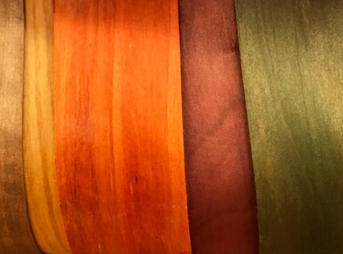 side of a basket made of thin cut of wood material and colored in orange green and brown tones - home decoration stock pictures, royalty-free photos & images
