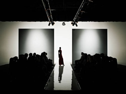 silhouette of female model on catwalk - fashion week stock pictures, royalty-free photos & images