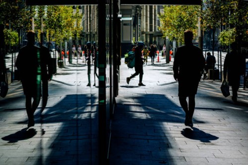 silhouette of people on city street, social distancing, coronavirus pandemic, sydney, australia - junk food stock pictures, royalty-free photos & images