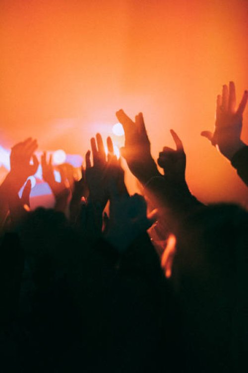 silhouette raised hands of men and women dancing at nightclub - concert stock pictures, royalty-free photos & images