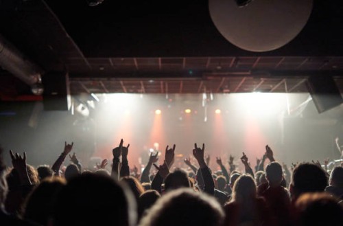 sillhouettes of concert crowd in front of bright stage lights - concert stock pictures, royalty-free photos & images