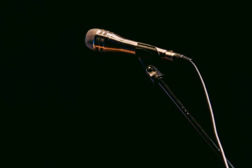 silver microphone stand with microphone on black background - concert stock pictures, royalty-free photos & images