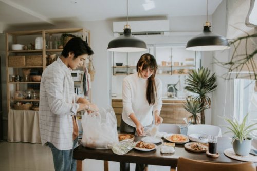 simple weekend in city life, unpacking delivery food. - junk food stock pictures, royalty-free photos & images