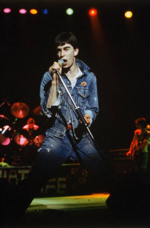 Singer Jimmy Pursey of British punk band Sham 69 performs on stage circa 1977.