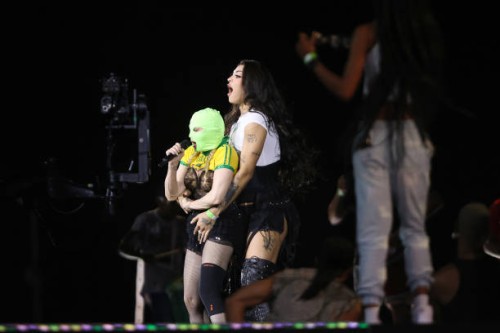 Singer Madonna wears a mask during a rehearsal with Brazilian singer Pabllo Vittar on stage at Copacabana Beach on May 3, 2024 in Rio de Janeiro,...
