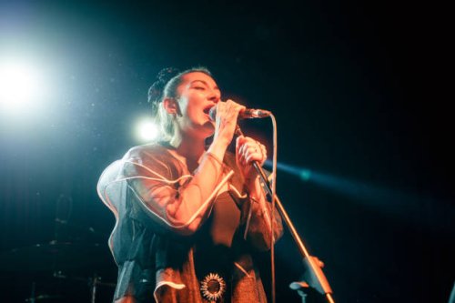 singer of music band performing on, stage light and smoke effects. - concert stock pictures, royalty-free photos & images