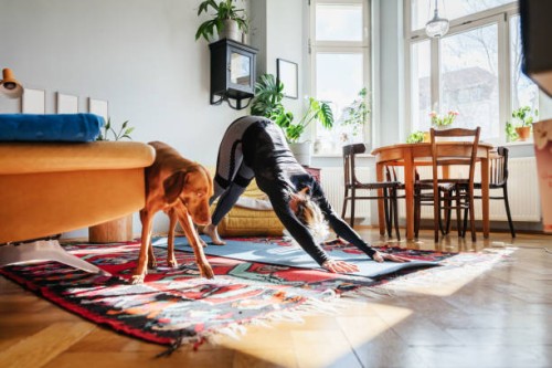 single mom doing yoga in living room at home - home decoration stock pictures, royalty-free photos & images