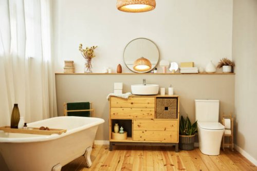 sink with toiletries kept on cabinet by bathtub - home decoration stock pictures, royalty-free photos & images