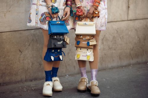Sisters Snehal and Jyoti Babani wear white colourful printed silk shirt dress, 12 Hermes bags, and pink colourful silk printed shirt dress, 12 Hermes...