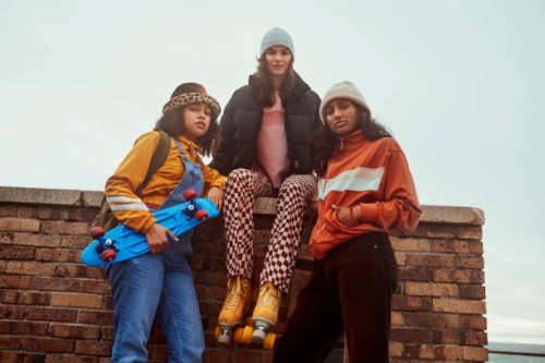 skateboard, fashion and diversity with girl friends outdoor for skating or leisure together. skater, winter and urban with a street style female friend group by a brick wall in contemporary clothes - fashion stock pictures, r
