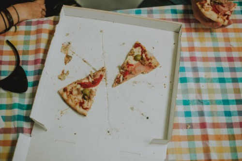 slice of tasty pizza with ham and tomatoes in box - junk food stock pictures, royalty-free photos & images
