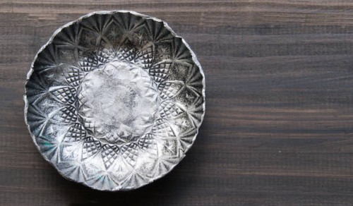 small textured metal plate on a wooden background - garden decoration stock pictures, royalty-free photos & images