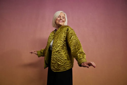 smiling elderly blond woman dancing in studio - fashion stock pictures, royalty-free photos & images
