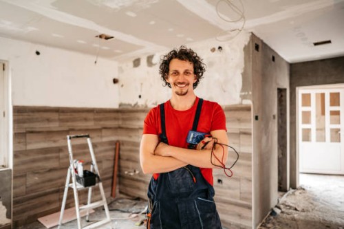 smiling electrician renovating house - home decoration stock pictures, royalty-free photos & images