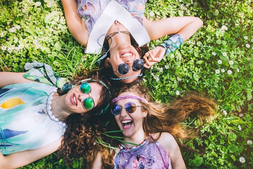 smiling faces of hippie female friends - fashion stock pictures, royalty-free photos & images