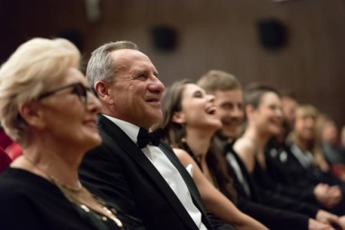 smiling spectators sitting in the theater - concert stock pictures, royalty-free photos & images