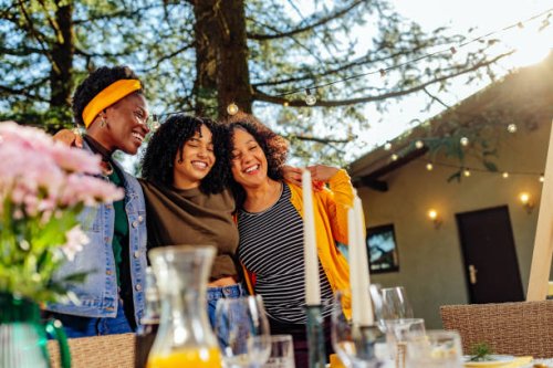 smiling three women at outdoors gathering - garden decoration stock pictures, royalty-free photos & images