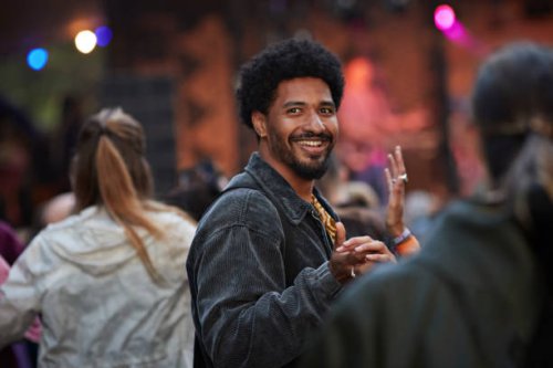 smiling young man dancing with girlfriend - concert stock pictures, royalty-free photos & images
