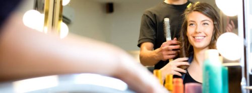 smiling young woman getting new hairstyle in the hair salon - hairstyle stock pictures, royalty-free photos & images