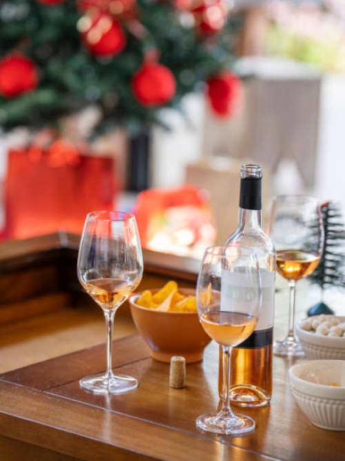 snacks and glasses of wine sitting on a table during a christmas party - home decoration stock pictures, royalty-free photos & images