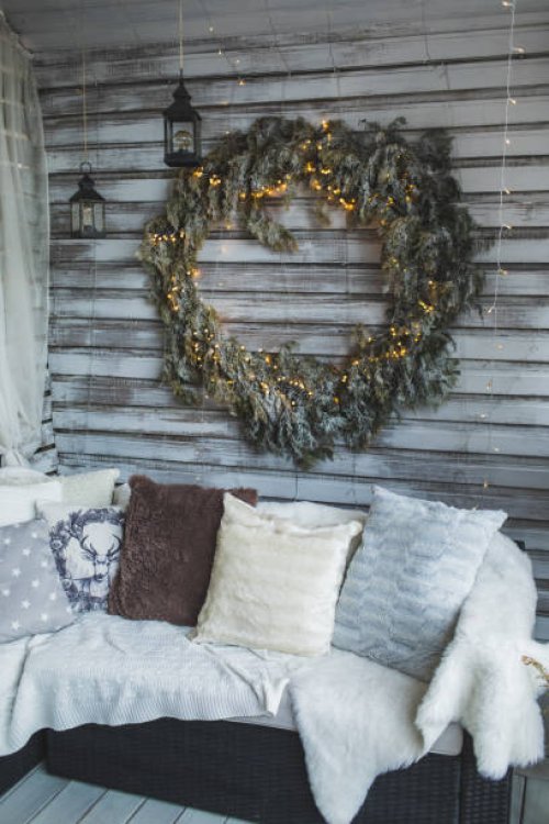 sofa with knit blankets and cushions on home cozy terrace with christmas decoration. - garden decoration stock pictures, royalty-free photos & images