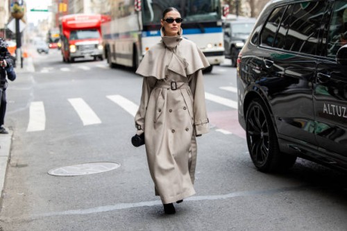 Sophia Roe wears grey belted coat outside Altuzarra during New York Fashion Week on February 08, 2025 in New York City.