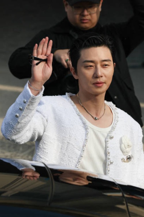 South Korean actor and singer Park Seo-joon waves as he arrives to attend the presentation by Chanel for the Womenswear Ready-to-wear Fall-Winter...