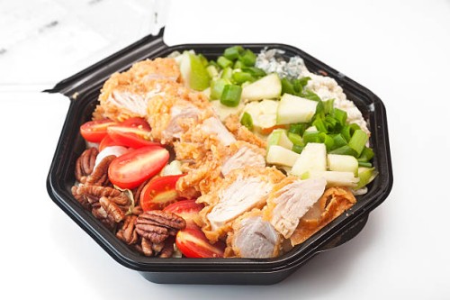 southern cobb salad in black plastic bowl - junk food stock pictures, royalty-free photos & images