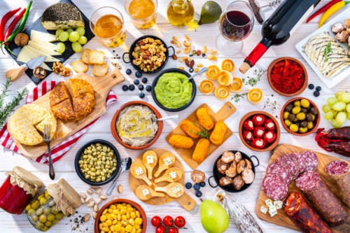 spanish tapas, beer and wine on white table - food stock pictures, royalty-free photos & images