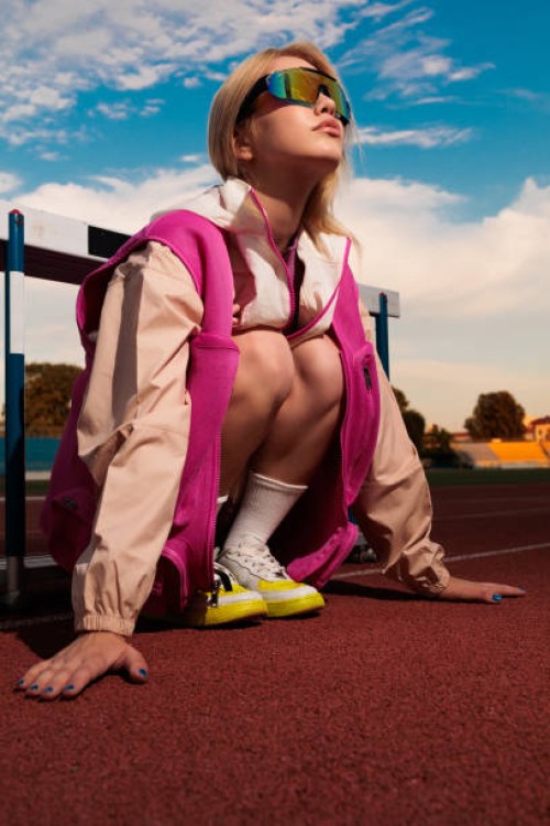 sport girl on racetrack doing warm-up - stock photo - fashion stock pictures, royalty-free photos & images