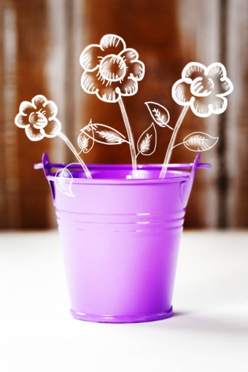 spring concept with purple bucket and flowers - garden decoration stock pictures, royalty-free photos & images