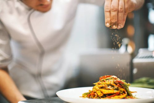 sprinkling seasonings from high up. - food stock pictures, royalty-free photos & images