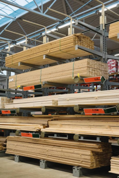 stacked wooden planks arranged on shelves in hardware store warehouse - home decoration stock pictures, royalty-free photos & images