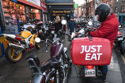 Staff of takeaway food online 'Just Eat' seen on Camden Street in Dublin. On Saturday, 14 January 2017, Dublin, Ireland.