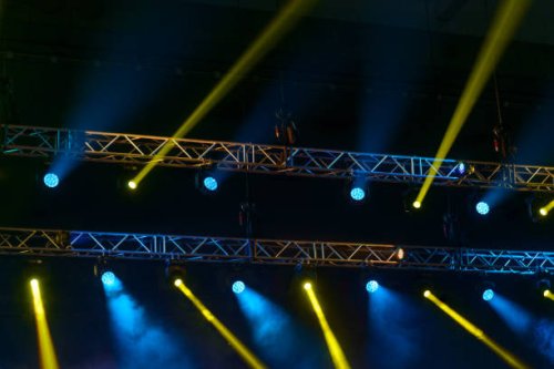 stage spotlights during music performance. - concert stock pictures, royalty-free photos & images