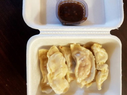 steamed dumplings stuffed with chicken meat in a disposable food box or container with sauce. - junk food stock pictures, royalty-free photos & images